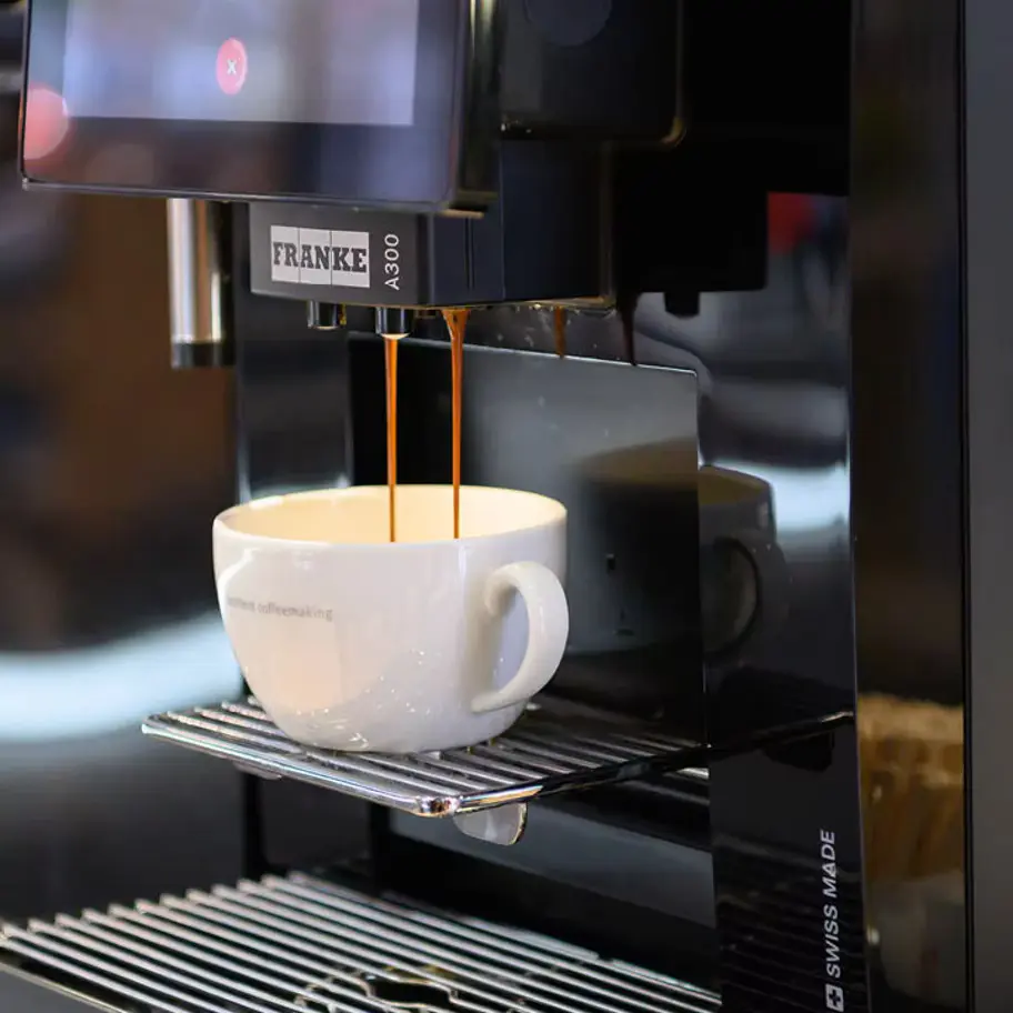 Franke A300 fully automatic coffee machine preparing a cup of cappuccino